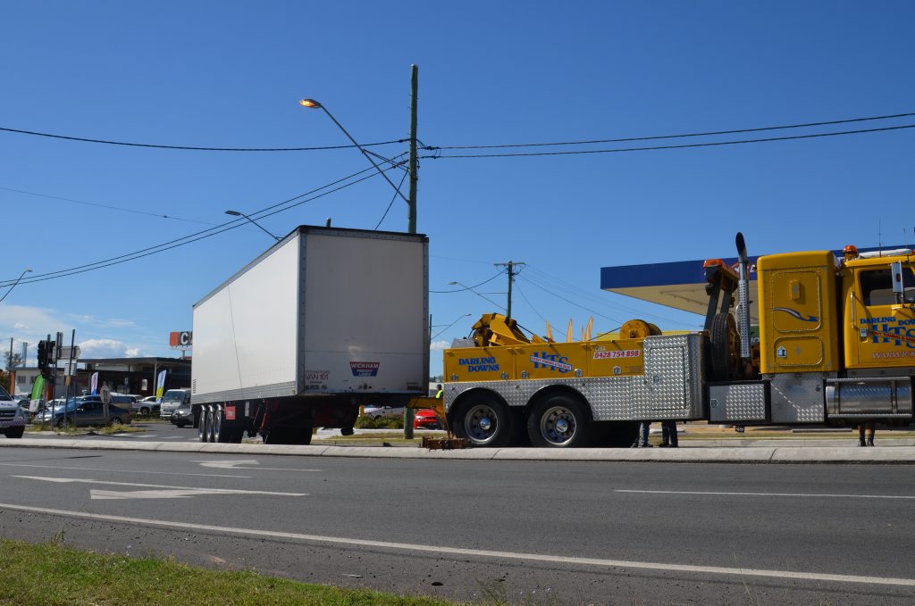 A freight container detached from its truck, blocking the southbound lane at the Wallace and Wood St intersection.